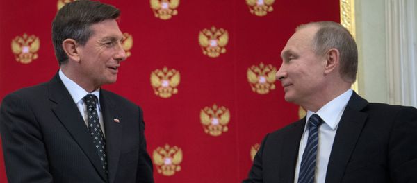 Russian President Vladimir Putin and Slovenia's President Borut Pahor, left, during a joint press conference following their meeting - Sputnik International