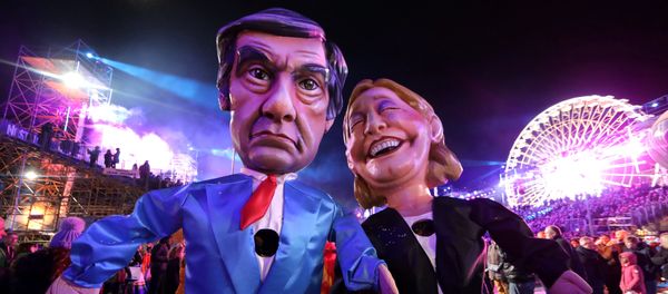 Figures of Francois Fillon (L), former French prime minister, member of The Republicans political party and 2017 presidential candidate of the French centre-right, and French National Front leader Marine Le Pen are paraded through the crowd during the 133rd Carnival parade, the first major event since the city was attacked during Bastille Day celebrations last year in Nice, France, February 11, 2017 Figures of Francois Fillon (L), former French prime minister, member of The Republicans political party and 2017 presidential candidate of the French centre-right, and French National Front leader Marine Le Pen are paraded through the crowd during the 133rd Carnival parade, the first major event since the city was attacked during Bastille Day celebrations last year in Nice, France, February 11, 2017 - Sputnik International
