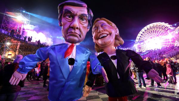 Figures of Francois Fillon (L), former French prime minister, member of The Republicans political party and 2017 presidential candidate of the French centre-right, and French National Front leader Marine Le Pen are paraded through the crowd during the 133rd Carnival parade, the first major event since the city was attacked during Bastille Day celebrations last year in Nice, France, February 11, 2017 Figures of Francois Fillon (L), former French prime minister, member of The Republicans political party and 2017 presidential candidate of the French centre-right, and French National Front leader Marine Le Pen are paraded through the crowd during the 133rd Carnival parade, the first major event since the city was attacked during Bastille Day celebrations last year in Nice, France, February 11, 2017 - Sputnik International