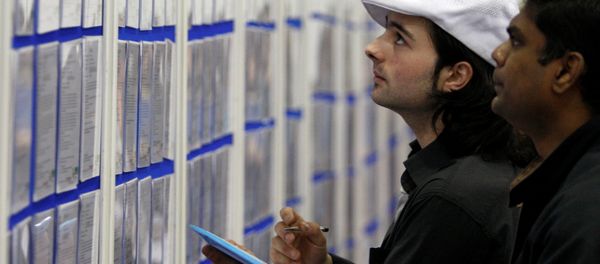 People look at job listings at the Careers and Jobs Live careers fair at the ExCeL centre in London (File) People look at job listings at the Careers and Jobs Live careers fair at the ExCeL centre in London (File) - Sputnik International
