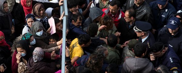 Refugees and migrants, most of them Afghans, block the entrance of the refugee camp at the disused Hellenikon airport as police officers try to disperse them, in Athens, Greece, February 6, 2017 Refugees and migrants, most of them Afghans, block the entrance of the refugee camp at the disused Hellenikon airport as police officers try to disperse them, in Athens, Greece, February 6, 2017 - Sputnik International