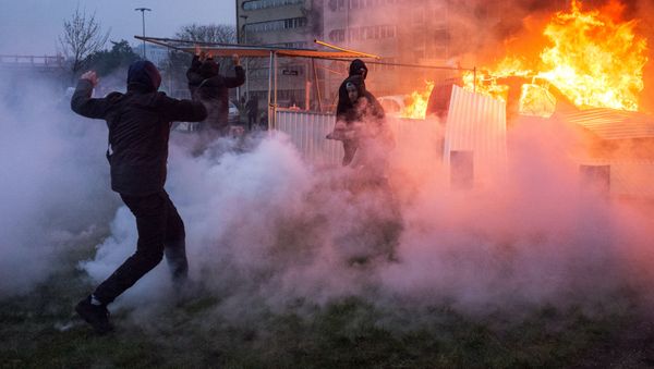 A car is ablaze in the Paris suburb of Bobigny during a protest against police brutality. file photo - Sputnik International