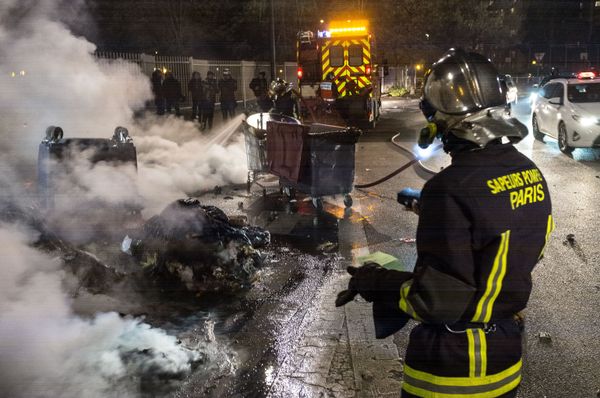 Firefighters extinguish garbage containers set ablaze during the unrest following a protest against police brutality in the Paris suburb of Bobigny. file photo Firefighters extinguish garbage containers set ablaze during the unrest following a protest against police brutality in the Paris suburb of Bobigny. file photo - Sputnik International