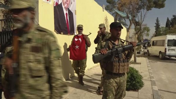 Turkish-backed Syrian opposition forces, one carrying a Turkish flag, patrol in Dabiq, Syria (File) - Sputnik International