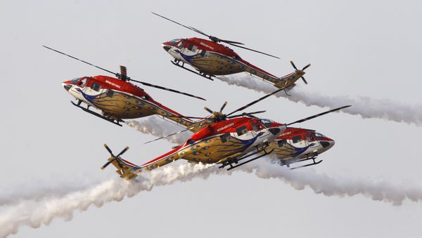 Indigenously manufactured Indian Air Force Dhruv helicopters perform an aerobatic manoeuvre  at Yelahanka air base in Bangalore (File) - Sputnik International