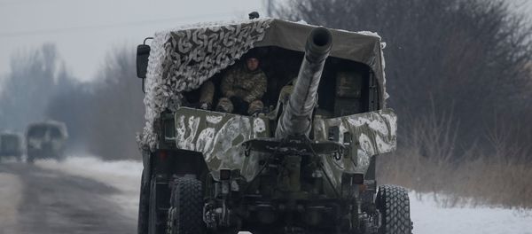 A military vehicle with cannon is seen near the government-held industrial town of Avdiyivka, Ukraine, February 2, 2017 - Sputnik International