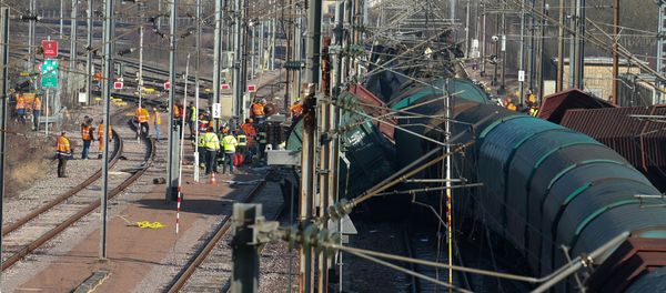 Rescuers stand next the wreckage of a passenger and freight train after a crash near Bettembourg, Luxembourg February 14, 2017 Rescuers stand next the wreckage of a passenger and freight train after a crash near Bettembourg, Luxembourg February 14, 2017 - Sputnik International