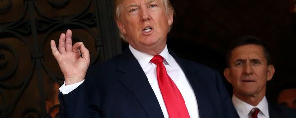 U.S. President-elect Donald Trump talks to members of the media as retired U.S. Army Lieutenant General Michael Flynn stands next to him at Mar-a-Lago estate in Palm Beach, Florida, U.S., December 21, 2016 U.S. President-elect Donald Trump talks to members of the media as retired U.S. Army Lieutenant General Michael Flynn stands next to him at Mar-a-Lago estate in Palm Beach, Florida, U.S., December 21, 2016 - Sputnik International