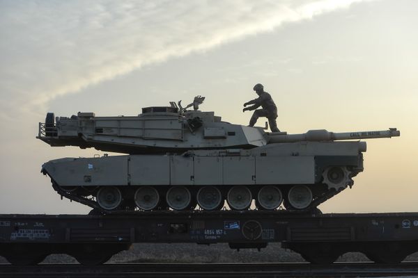 A serviceman of the Fighting Eagles 1st Battalion, 8th Infantry Regiment, walks on a tank that arrived via train to the US base in Mihail Kogalniceanu, eastern Romania, Tuesday, Feb. 14, 2017. Five hundred U.S. troops began to arrive in a Black Sea port in Romania with tanks and hardware to bolster defense in this East European NATO nation. - Sputnik International