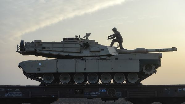 A serviceman of the Fighting Eagles 1st Battalion, 8th Infantry Regiment, walks on a tank that arrived via train to the US base in Mihail Kogalniceanu, eastern Romania, Tuesday, Feb. 14, 2017. Five hundred U.S. troops began to arrive in a Black Sea port in Romania with tanks and hardware to bolster defense in this East European NATO nation. A serviceman of the Fighting Eagles 1st Battalion, 8th Infantry Regiment, walks on a tank that arrived via train to the US base in Mihail Kogalniceanu, eastern Romania, Tuesday, Feb. 14, 2017. Five hundred U.S. troops began to arrive in a Black Sea port in Romania with tanks and hardware to bolster defense in this East European NATO nation. - Sputnik International