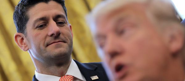 U.S. Speaker of the House Paul Ryan looks at U.S. President Donald Trump as he signs H.J.Res. 41, providing for congressional disapproval of a rule submitted by the Securities and Exchange Commission relating to Disclosure of Payments by Resource Extraction Issuers. at the Oval Office of the White House in Washington, U.S., February 14, 2017 - Sputnik International