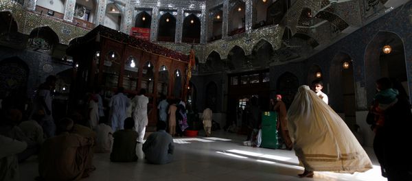 A woman clad in burqa walks in the hallway of the tomb of Sufi saint Syed Usman Marwandi, also known as Lal Shahbaz Qalandar, in Sehwan Sharif, in Pakistan's southern Sindh province. (File) A woman clad in burqa walks in the hallway of the tomb of Sufi saint Syed Usman Marwandi, also known as Lal Shahbaz Qalandar, in Sehwan Sharif, in Pakistan's southern Sindh province. (File) - Sputnik International