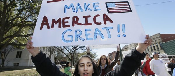 A protester holds a sign during a Day Without Immigrants Protest in Texas - Sputnik International