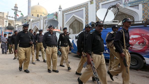 Policemen gather outside the tomb of Sufi saint Syed Usman Marwandi, also known as the Lal Shahbaz Qalandar shrine, after Thursday's suicide blast in Sehwan Sharif, Pakistan's southern Sindh province, February 17, 2017. Policemen gather outside the tomb of Sufi saint Syed Usman Marwandi, also known as the Lal Shahbaz Qalandar shrine, after Thursday's suicide blast in Sehwan Sharif, Pakistan's southern Sindh province, February 17, 2017. - Sputnik International