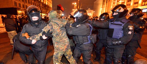 Police detain a protester during a rally against trade with Ukraine's rebel-held eastern areas in the Donetsk and Luhansk regions, in central Kiev, Ukraine February 19, 2017 - Sputnik International