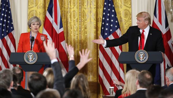 President Donald Trump and British Prime Minister Theresa May during their joint news conference in the East Room of the White House White House in Washington, Friday, Jan. 27, 2017. - Sputnik International