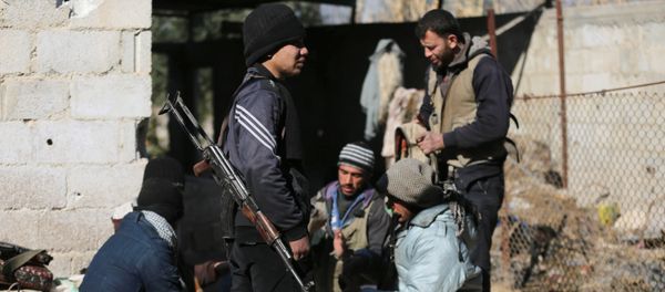 Fighters from the Jaish al-Islam (Islam Army), the foremost rebel group in Damascus province who fiercely oppose both the Syrian regime and the Islamic State group, gather inside a building on the frontline in the town of Bilaliyah, east of the capital Damascus, on February 4, 2017 Fighters from the Jaish al-Islam (Islam Army), the foremost rebel group in Damascus province who fiercely oppose both the Syrian regime and the Islamic State group, gather inside a building on the frontline in the town of Bilaliyah, east of the capital Damascus, on February 4, 2017 - Sputnik International