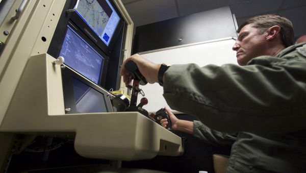 Col. Charles W. Manley, commander of the 163d Maintenance Group,163d Reconnaissance Wing, pilots a training simulator for the U.S. Air Force's MQ-1 Predator, at the March Air Reserve Base in Riverside County, Calif., in this June 25, 2008 file photo - Sputnik International