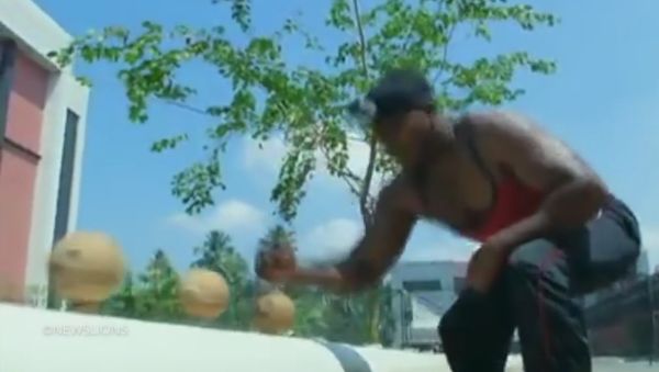 Man smashes 124 coconuts with bare hand in less than a minute - Sputnik International