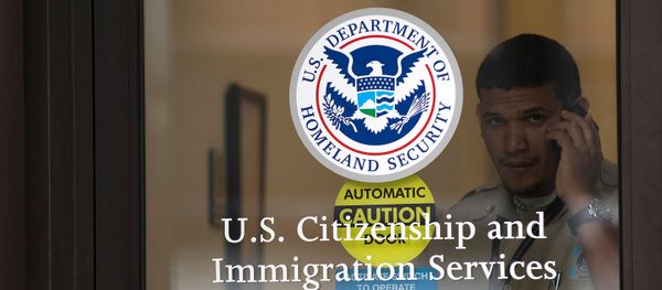 A security guard looks out of the U.S. Citizenship and Immigration Services offices in New York, U.S. (File) - Sputnik International