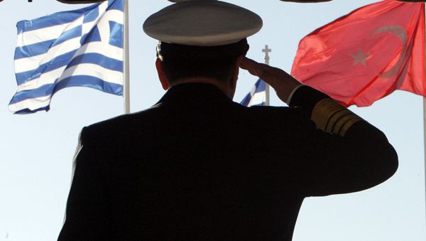 Greece's military Adm. Panagiotis Chinofotis salutes during the Turkish national anthem as the Greek, left, and Turkish flags wave at the Greek Defense Ministry in Athens on Thursday, Nov. 2, 2006 Greece's military Adm. Panagiotis Chinofotis salutes during the Turkish national anthem as the Greek, left, and Turkish flags wave at the Greek Defense Ministry in Athens on Thursday, Nov. 2, 2006 - Sputnik International