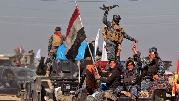 Iraqi security forces regroup in the village of al-Buseif, south of Mosul, during an offensive by Iraqi forces to retake the western side of the city from Islamic State (IS) group fighters on February 22, 2017 Iraqi security forces regroup in the village of al-Buseif, south of Mosul, during an offensive by Iraqi forces to retake the western side of the city from Islamic State (IS) group fighters on February 22, 2017 - Sputnik International