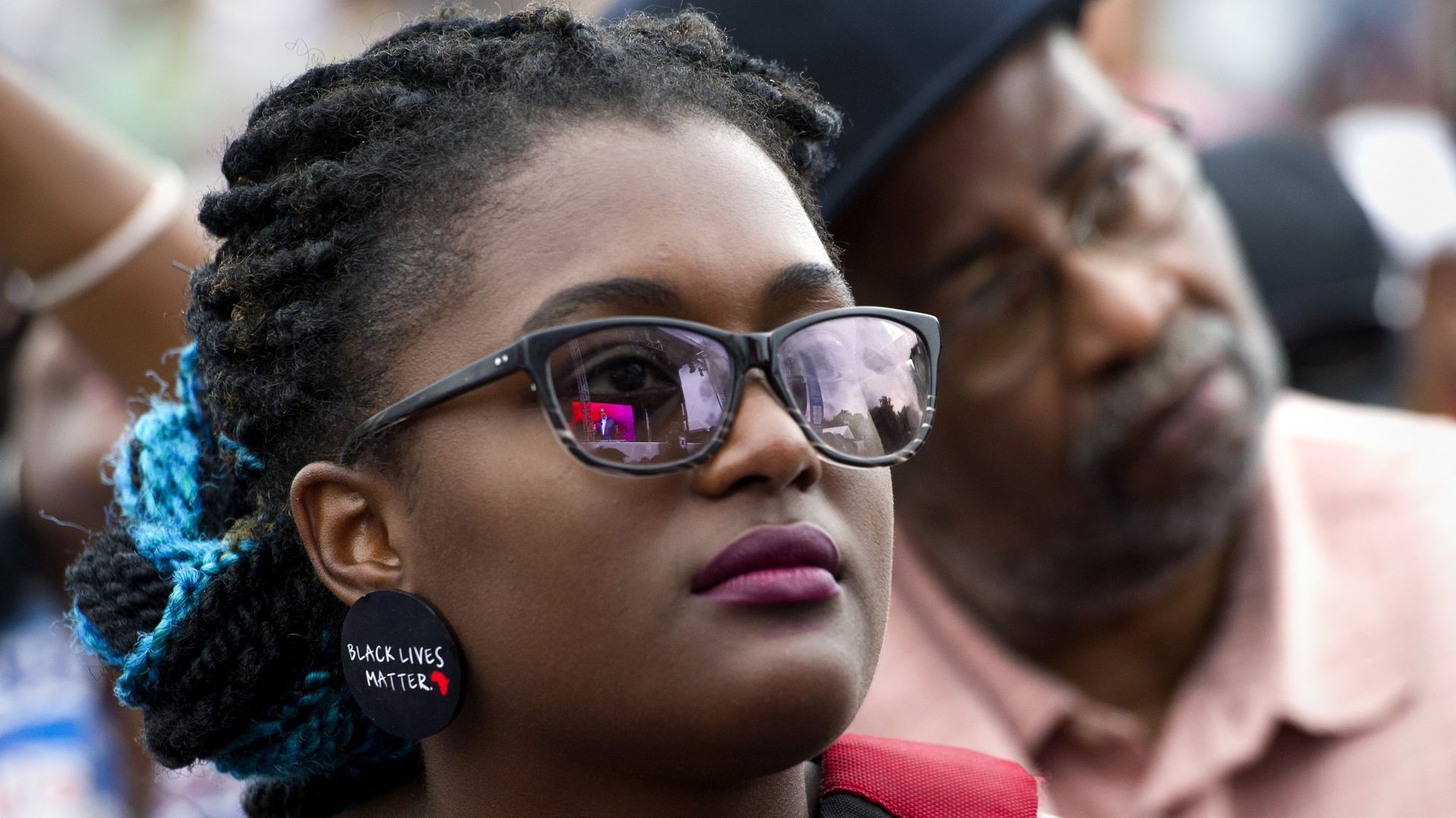 A young woman wears earrings with the slogan Black Lives Matter printed on them during the dedication and opening ceremony of the Smithsonian's National Museum of African American History and Culture in Washington, Saturday, Sept. 24, 2016. A young woman wears earrings with the slogan Black Lives Matter printed on them during the dedication and opening ceremony of the Smithsonian's National Museum of African American History and Culture in Washington, Saturday, Sept. 24, 2016. - Sputnik International, 1920, 31.05.2022