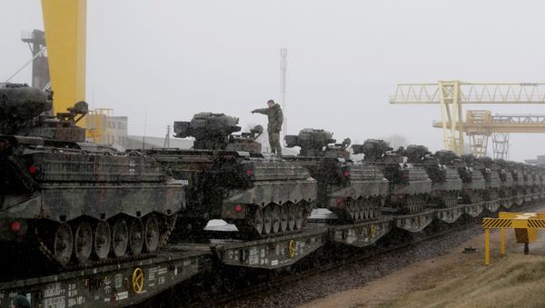 A German army soldier prepares to unload Marder infantry fighting vehicles at the railway station in Sestokai, Lithuania, February 24, 2017 A German army soldier prepares to unload Marder infantry fighting vehicles at the railway station in Sestokai, Lithuania, February 24, 2017 - Sputnik International