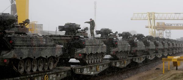 A German army soldier prepares to unload Marder infantry fighting vehicles at the railway station in Sestokai, Lithuania, February 24, 2017 - Sputnik International