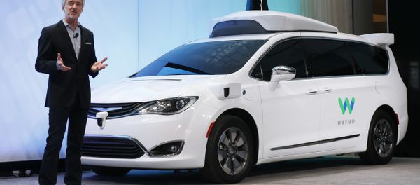 In this Sunday, Jan. 8, 2017, file photo, John Krafcik, CEO of Waymo, the autonomous vehicle company created by Google's parent company, Alphabet, introduces a Chrysler Pacifica hybrid outfitted with Waymo's own suite of sensors and radar, at the North American International Auto Show in Detroit. - Sputnik International