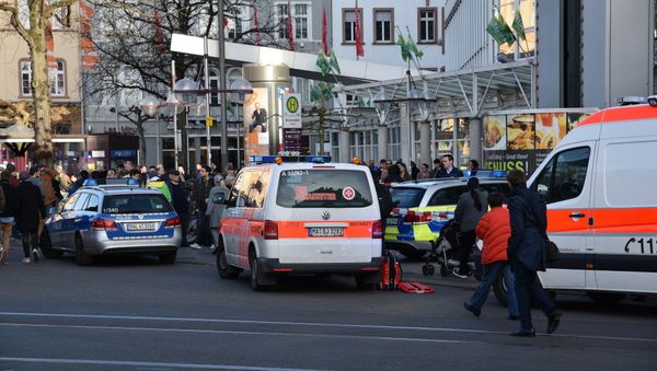 Police vehicle and ambulance stand in front of a business building in Heidelberg, western Germany, where a man ploughed into pedestrians Police vehicle and ambulance stand in front of a business building in Heidelberg, western Germany, where a man ploughed into pedestrians - Sputnik International