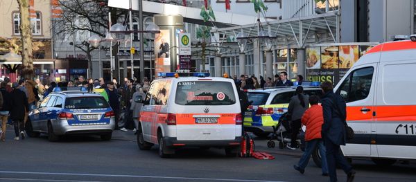 Police vehicle and ambulance stand in front of a business building in Heidelberg, western Germany, where a man ploughed into pedestrians - Sputnik International