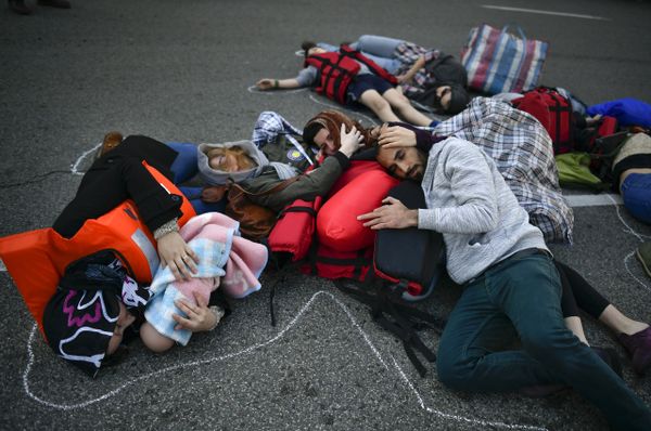 Demonstrators make a performance on the street during a protest in support of refugees and migrants entering Europe, in Pamplona, northern Spain - Sputnik International