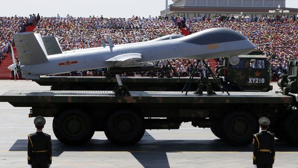 Military vehicles carry Wing Loong drones, a Chinese made medium-altitude long-endurance unmanned aerial vehicle, past spectators during a parade commemorating the 70th anniversary of Japan's surrender during World War II held in front of Tiananmen Gate in Beijing, Thursday, Sept. 3, 2015 Military vehicles carry Wing Loong drones, a Chinese made medium-altitude long-endurance unmanned aerial vehicle, past spectators during a parade commemorating the 70th anniversary of Japan's surrender during World War II held in front of Tiananmen Gate in Beijing, Thursday, Sept. 3, 2015 - Sputnik International