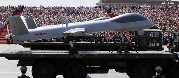 Military vehicles carry Wing Loong drones, a Chinese made medium-altitude long-endurance unmanned aerial vehicle, past spectators during a parade commemorating the 70th anniversary of Japan's surrender during World War II held in front of Tiananmen Gate in Beijing, Thursday, Sept. 3, 2015 Military vehicles carry Wing Loong drones, a Chinese made medium-altitude long-endurance unmanned aerial vehicle, past spectators during a parade commemorating the 70th anniversary of Japan's surrender during World War II held in front of Tiananmen Gate in Beijing, Thursday, Sept. 3, 2015 - Sputnik International