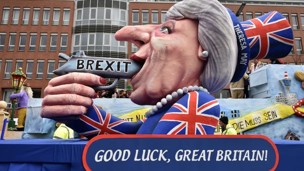 A carnival float depicts British Prime Minister Theresa May with a gun and the writing 'Brexit' on it prior to the traditional carnival parade in Duesseldorf, Germany, on Monday, Feb. 27, 2017. A carnival float depicts British Prime Minister Theresa May with a gun and the writing 'Brexit' on it prior to the traditional carnival parade in Duesseldorf, Germany, on Monday, Feb. 27, 2017. - Sputnik International