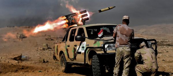 Members of the Iraqi army's 9th Division fire a multiple rocket launcher from a hill in Talul al-Atshana, on the southwestern outskirts of Mosul, on February 27, 2017, during an offensive to retake the city from Islamic State (IS) group fighters Members of the Iraqi army's 9th Division fire a multiple rocket launcher from a hill in Talul al-Atshana, on the southwestern outskirts of Mosul, on February 27, 2017, during an offensive to retake the city from Islamic State (IS) group fighters - Sputnik International