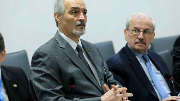 Syrian Ambassador to the U.N. Bashar al Jaafari (L) attends a meeting of Intra-Syria peace talks with UN Special Envoy for Syria Staffan de Mistura at Palais des Nations in Geneva, Switzerland, February 25, 2017 - Sputnik International