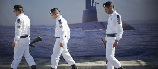 Israeli naval soldiers honor guard walks past a poster of a submarine as they wait for the arrival of a new navy submarine Rahav in the military port in Haifa, Israel, Tuesday, Jan. 12, 2016. Israeli naval soldiers honor guard walks past a poster of a submarine as they wait for the arrival of a new navy submarine Rahav in the military port in Haifa, Israel, Tuesday, Jan. 12, 2016. - Sputnik International