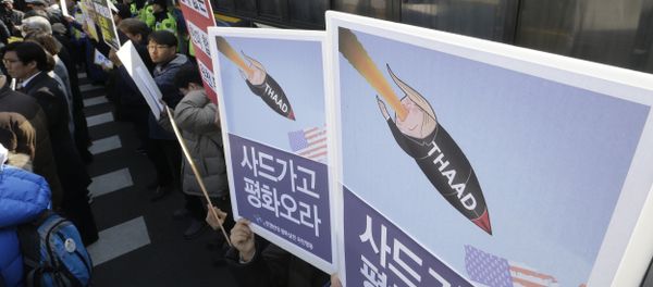 South Korean protesters stage a rally to oppose a plan to deploy an advanced U.S. missile defense system called Terminal High-Altitude Area Defense, or THAAD, in front of the Defense Ministry in Seoul, South Korea, Tuesday, Feb. 28, 2017 - Sputnik International
