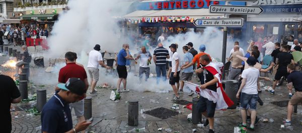 French police use tear gas against England supporters in downtown Marseille, France, Friday, June 10, 2016 French police use tear gas against England supporters in downtown Marseille, France, Friday, June 10, 2016 - Sputnik International