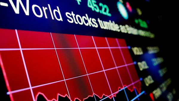 Electronic boards display the days loss to the Dow Jones Industrial Average (DJI) above the floor of the New York Stock Exchange (NYSE) in New York, U.S. (File) - Sputnik International