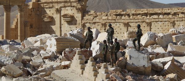Syrian army soldiers stand on the ruins of the Temple of Bel in the historic city of Palmyra, in Homs Governorate (File) Syrian army soldiers stand on the ruins of the Temple of Bel in the historic city of Palmyra, in Homs Governorate (File) - Sputnik International