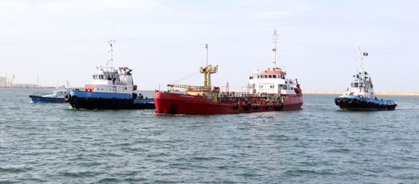 An oil tanker arrives, escorted by Libyan coastguard, at Tripoli’s maritime base (File) An oil tanker arrives, escorted by Libyan coastguard, at Tripoli’s maritime base (File) - Sputnik International