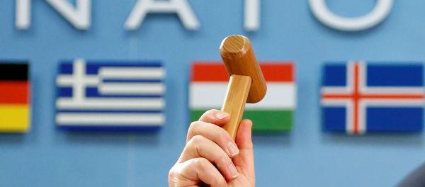 NATO Secretary-General Jens Stoltenberg holds up a ceremonial hammer at the start of a NATO-Georgia defence ministers meeting at the Alliance headquarters in Brussels, Belgium February 16, 2017. NATO Secretary-General Jens Stoltenberg holds up a ceremonial hammer at the start of a NATO-Georgia defence ministers meeting at the Alliance headquarters in Brussels, Belgium February 16, 2017. - Sputnik International