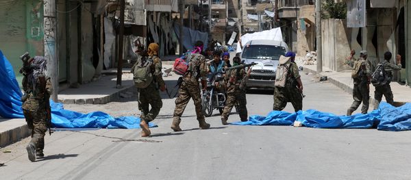 Members of the Syrian Democratic Forces (SDF) patrol a street in the northern Syrian town of Manbij (File) Members of the Syrian Democratic Forces (SDF) patrol a street in the northern Syrian town of Manbij (File) - Sputnik International
