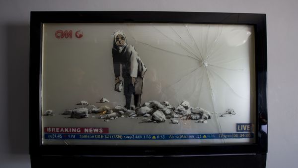 Banksy's work is displayed in the The Walled Off Hotel in the West Bank city of Bethlehem, Friday, March 3, 2017. The owner of a guest house packed with the elusive artist Banksy's work has opened the doors of his West Bank establishments to media, showcasing its unique worst view in the world. The nine-room hotel named The Walled Off Hotel will officially open on March 11. - Sputnik International