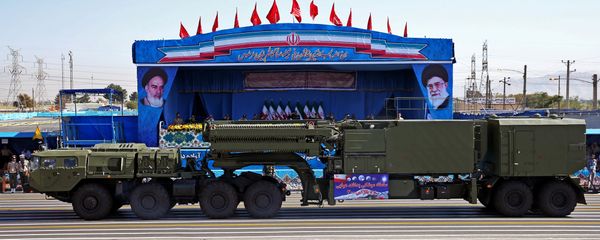 In front of the portraits of supreme leader Ayatollah Ali Khamenei, right, and late revolutionary founder Ayatollah Khomeini, left, a long-range, S-300 missile system is displayed by Iran's army during a military parade marking the 36th anniversary of Iraq's 1980 invasion of Iran, in front of the shrine of late revolutionary founder Ayatollah Khomeini, just outside Tehran, Iran In front of the portraits of supreme leader Ayatollah Ali Khamenei, right, and late revolutionary founder Ayatollah Khomeini, left, a long-range, S-300 missile system is displayed by Iran's army during a military parade marking the 36th anniversary of Iraq's 1980 invasion of Iran, in front of the shrine of late revolutionary founder Ayatollah Khomeini, just outside Tehran, Iran - Sputnik International