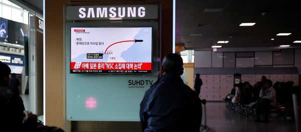 Passengers watch a television broadcasting a news report on North Korea firing ballistic missiles, at a railway station in Seoul, South Korea, March 6, 2017. Passengers watch a television broadcasting a news report on North Korea firing ballistic missiles, at a railway station in Seoul, South Korea, March 6, 2017. - Sputnik International