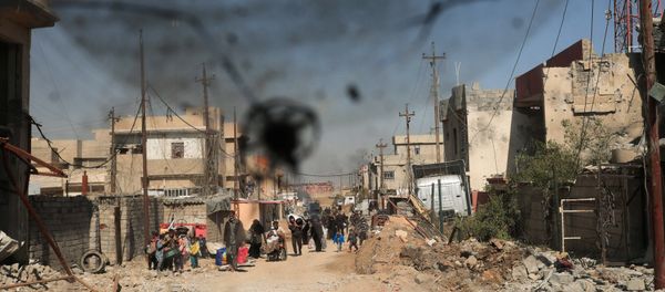Displaced Iraqis flee their homes in Al Mansour district, as Iraqi forces battle with DAESH militants, in western Mosul, Iraq March 6, 2017. Displaced Iraqis flee their homes in Al Mansour district, as Iraqi forces battle with DAESH militants, in western Mosul, Iraq March 6, 2017. - Sputnik International